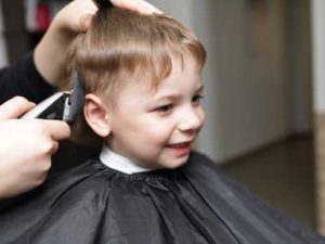 Little boy getting a haircut